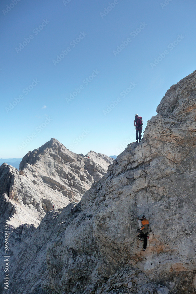 Climber at Jubilaumsgrat via ferrata, Zugspitze mountain, Germany