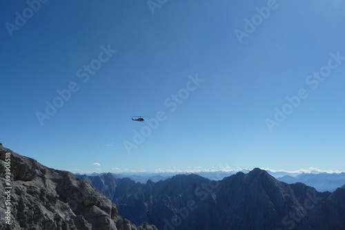 Helicopter at Jubilaumsgrat, Zugspitze mountain, Germany photo