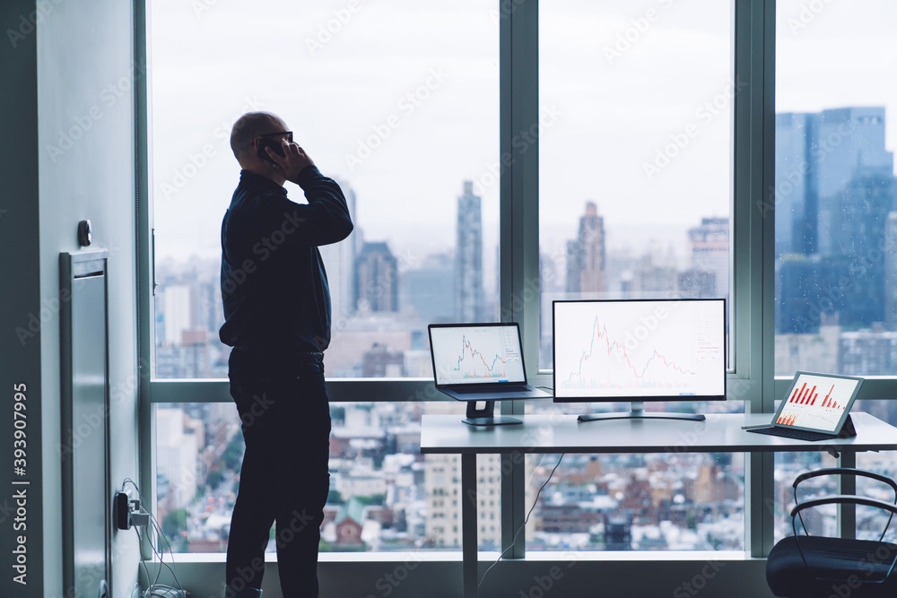 Anonymous businessman calling on smartphone