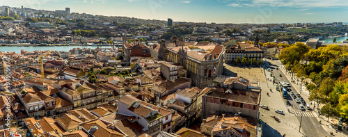 A panorama view towards Museum of Photography and the Douro river across the roof tops of Porto, Portugal from the Clerigos Tower on a sunny afternoon photo