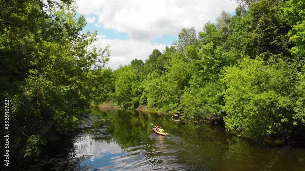 Aerial drone view of sport canoe on summer calm forest river. Sport, recreation, healthy lifestyle, isolation concept. Aerial drone view of sport canoe on summer calm forest river. Sport, recreation, healthy lifestyle, isolation concept.