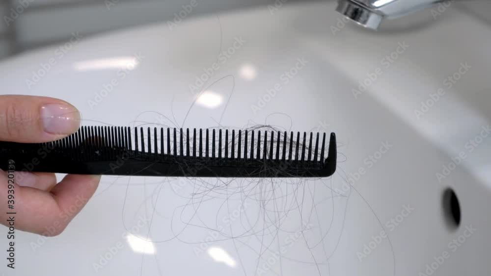 Hair left on the comb after brushing the hair. Hair loss problem Hair left on the comb after brushing the hair. Hair loss problem