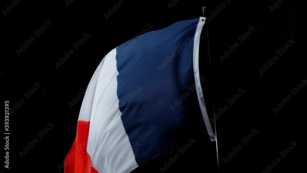 Super slow motion of waving flag of France isolated on black background. Filmed on high speed cinema camera, 1000fps.