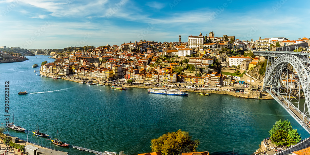 The Douro river by the Dom Luiz bridge into the old quarter of Porto, Portugal on a sunny afternoon