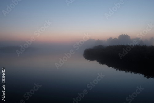 Sonnenaufgang im Nebel über dem Hafen Prerow am Prerowstrom, Halbinsel Fischland-Darss-Zingst, Mecklenburg-Vorpommern, Deutschland photo