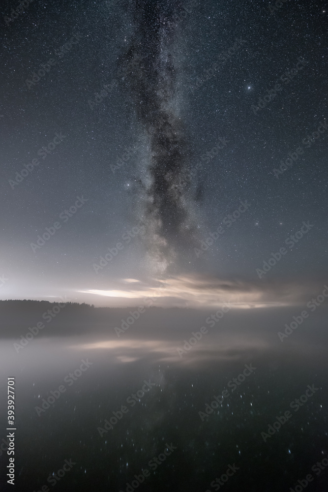 The Milky Way above a foggy lake