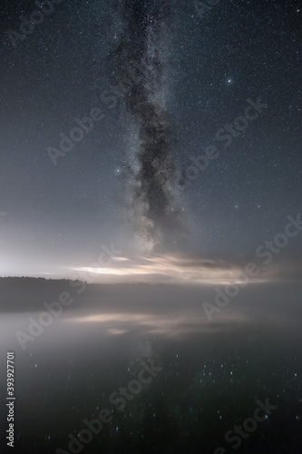 The Milky Way above a foggy lake