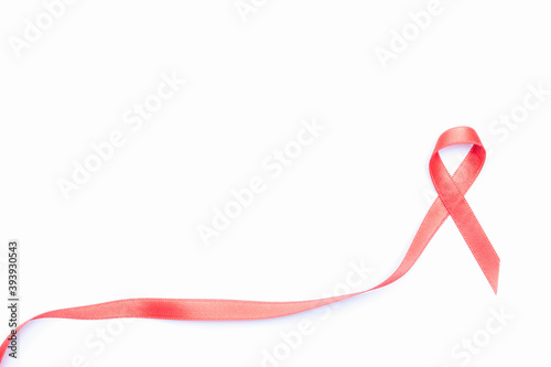 Breast cancer woman. Red ribbon symbol in hiv world day isolated on white background. Awareness aids and cancer. Healthcare and medical concept. photo