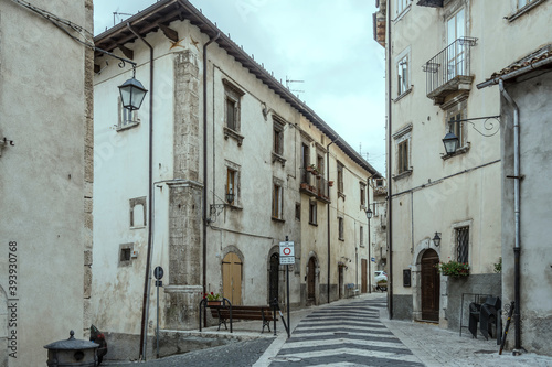 Fototapeta Naklejka Na Ścianę i Meble -  old houses on street with decorated paving, Pescocostanzo, Abruzzo, Italy