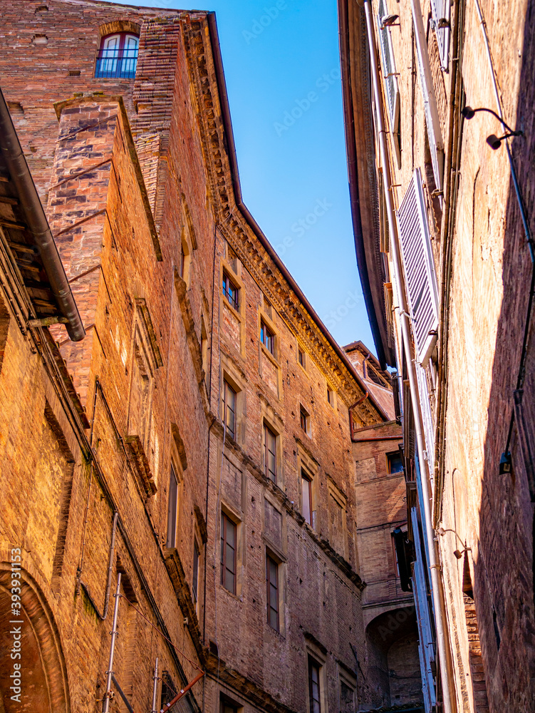 Fototapeta premium Medieval palaces in the historic center of the city of Siena (Italy)