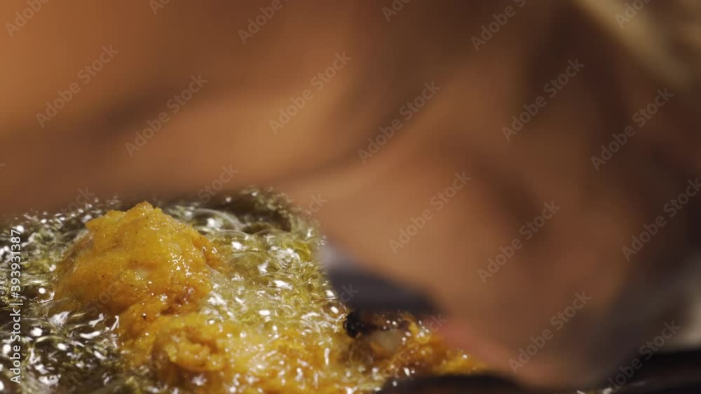 Chicken meat get fried in a pan full of boiling oil. Crispy menu. Macro ...