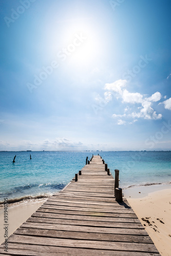 Wooden pier on tropical beach. Travel destinations