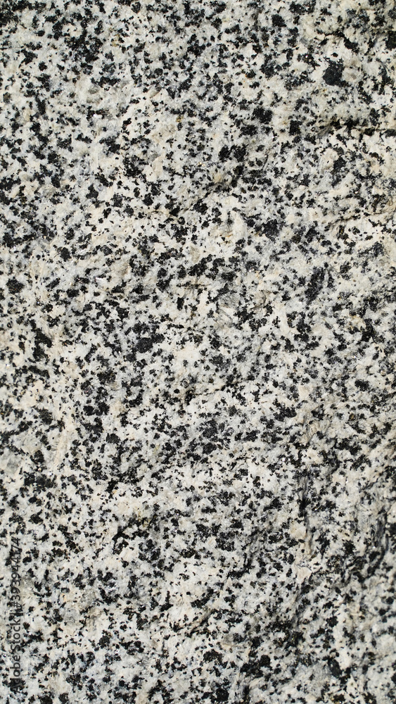 Texture and background for the material. Unique pattern of gray cement texture in the pimples of the wall. Texture and background for the material. Unique pattern of gray cement texture in the pimples of the wall.