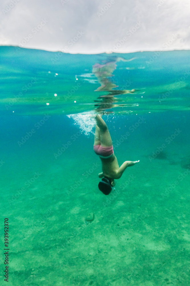 Little kid diving on the Mediterranean sea