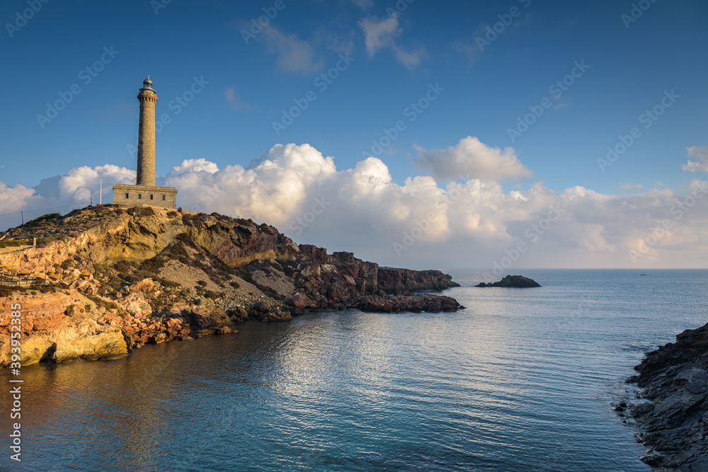 Lighthouse of Cabo de Palos from a beautiful beach at sunrise, Murcia, Spain