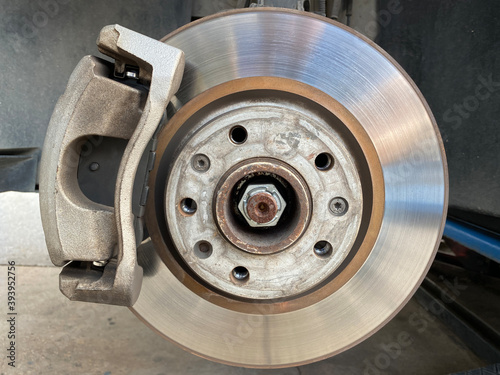 Braking system with disk open for repair maintenance and service. Close up disk brake of car