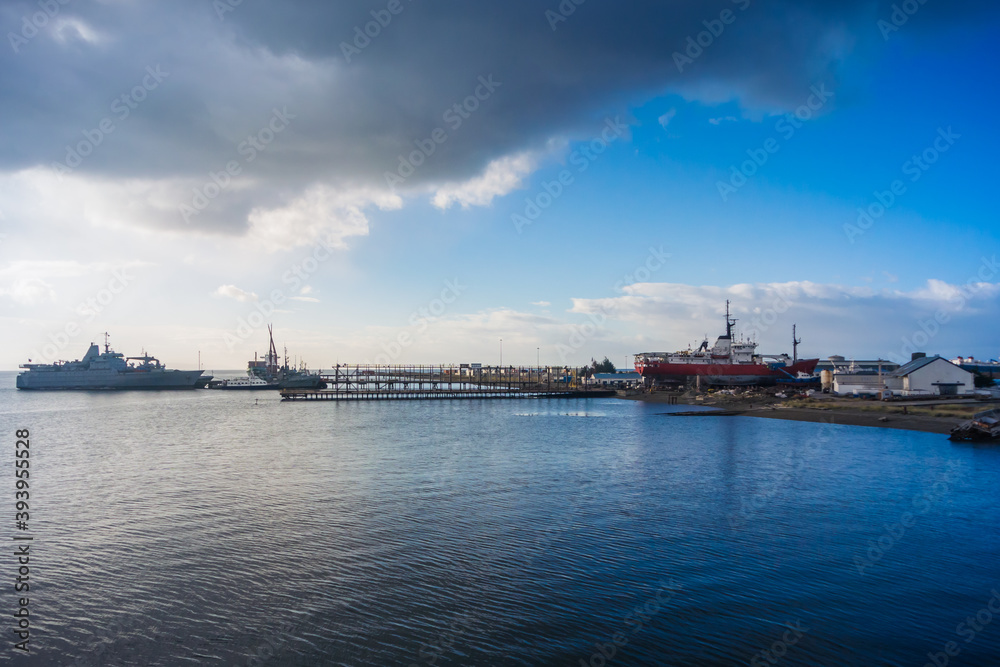 Punta Arenas / Magallanes y la Antartica Chilena Region / Chile. February 14, 2018: Ships in the port area of Punta Arenas in the Strait of Magallanes. Punta Arenas / Magallanes y la Antartica Chilena Region / Chile. February 14, 2018: Ships in the port area of Punta Arenas in the Strait of Magallanes.
