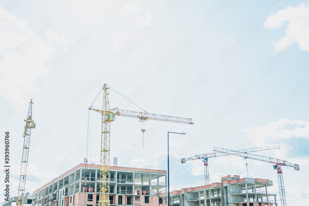 Construction of an apartment building, sunny day, blu sky, copy space Construction of an apartment building, sunny day, blu sky, copy space