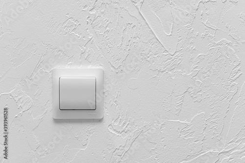 Light switch on the white wall, copy space