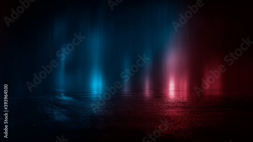 Neon futuristic landscape of a night street with neon light reflected in the water. Wet street, red and blue neon lights. Urban neon abstraction. Dark street wet asphalt reflections of rays.