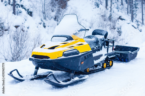 Snowmobiles and forest, mountain