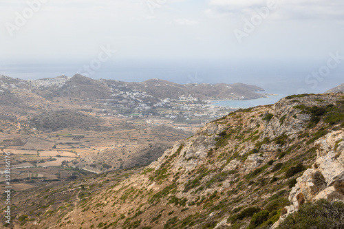 A view of the hazy west coast of Ios Island. Chora town and port in the background. Cyclades, Greece © vivoo
