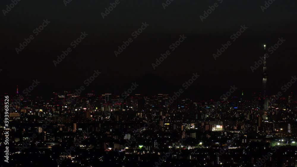 TOKYO, JAPAN : Aerial high angle sunrise CITYSCAPE of TOKYO and MOUNT FUJI. View of rising sun and buildings at downtown area. Japanese city life and nature concept. Time lapse shot night to morning. TOKYO, JAPAN : Aerial high angle sunrise CITYSCAPE of TOKYO and MOUNT FUJI. View of rising sun and buildings at downtown area. Japanese city life and nature concept. Time lapse shot night to morning.