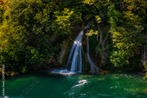 Waterfall and clear river water. Near the source of the Krka River in Croatia. Long exposure  september 2020