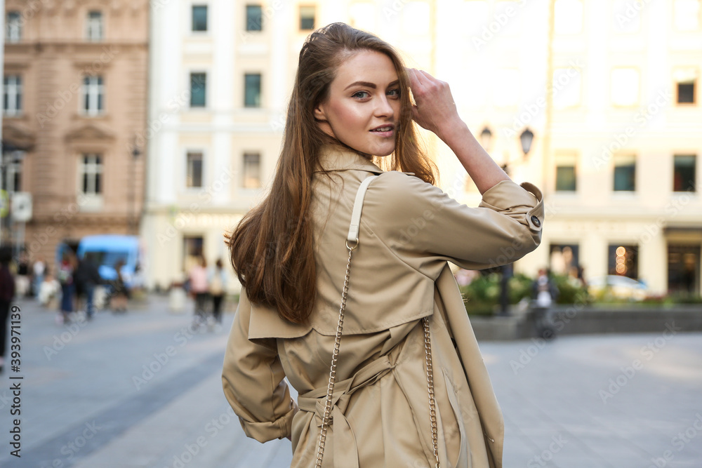 beautiful woman walking in the city in spring beautiful woman walking in the city in spring