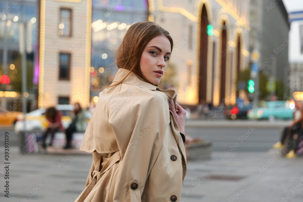 beautiful woman walking in the city in spring beautiful woman walking in the city in spring