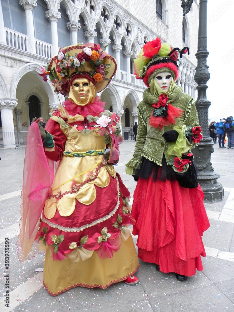 Colorful Venetian costumes, carnival masks