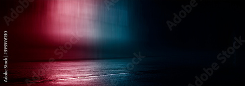 Neon futuristic landscape of a night street with neon light reflected in the water. Wet street, red and blue neon lights. Urban neon abstraction.  © MiaStendal