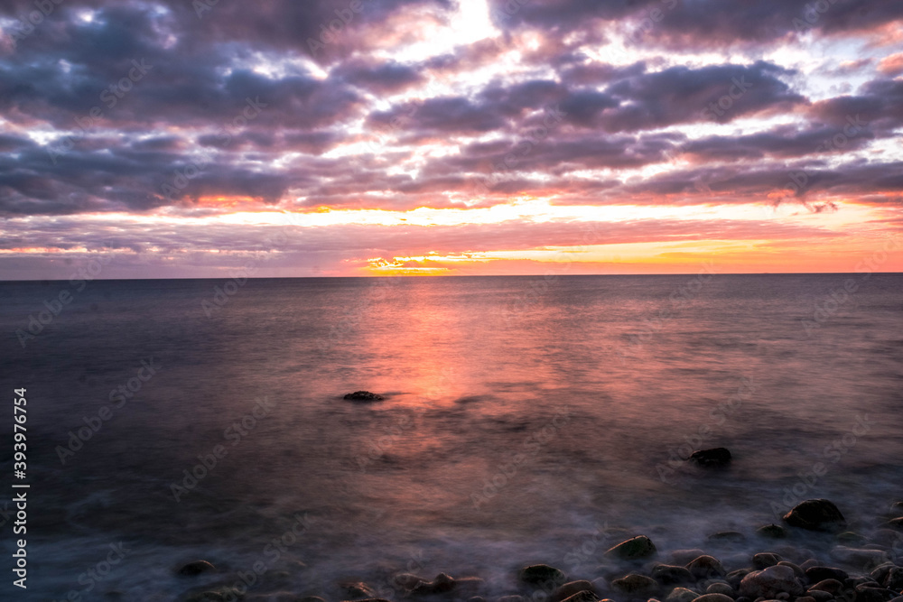 Rocky beach in Cobeta Fuma, Alicante, Spain, at sunrise