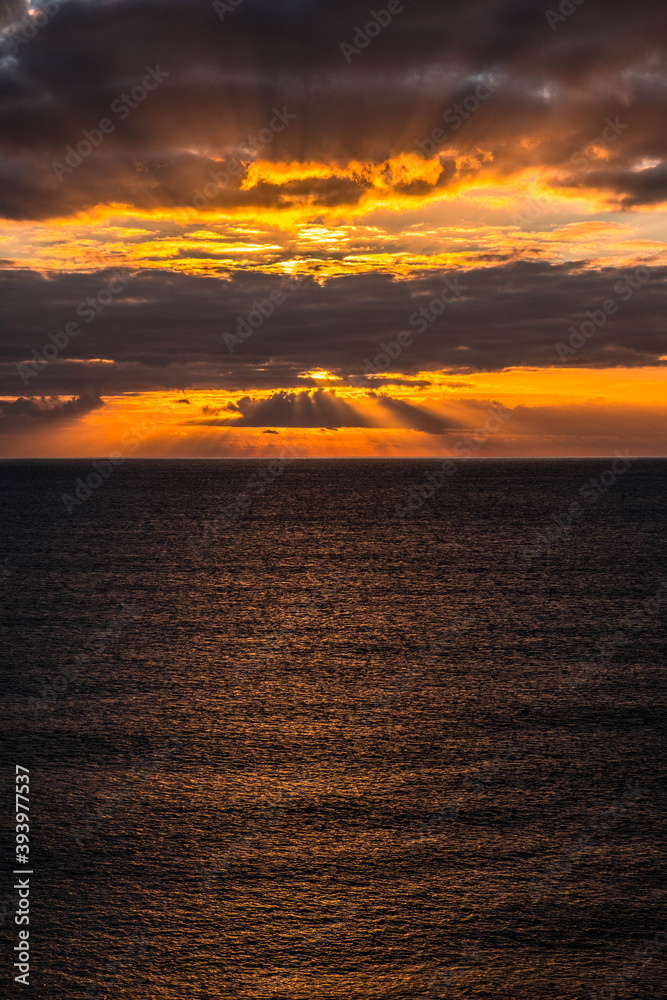 Fototapeta premium Rocky beach in Cobeta Fuma, Alicante, Spain, at sunrise