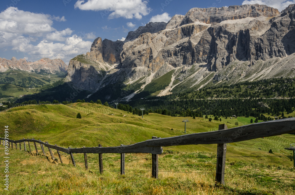 Fototapeta premium Sella group, plateau-shaped mountain massif in the Dolomites, north of the Marmolada and east of Sasso Lungo, seen from the trail to Sella pass & Sella refuge from Comici refuge, South Tyrol, Italy.