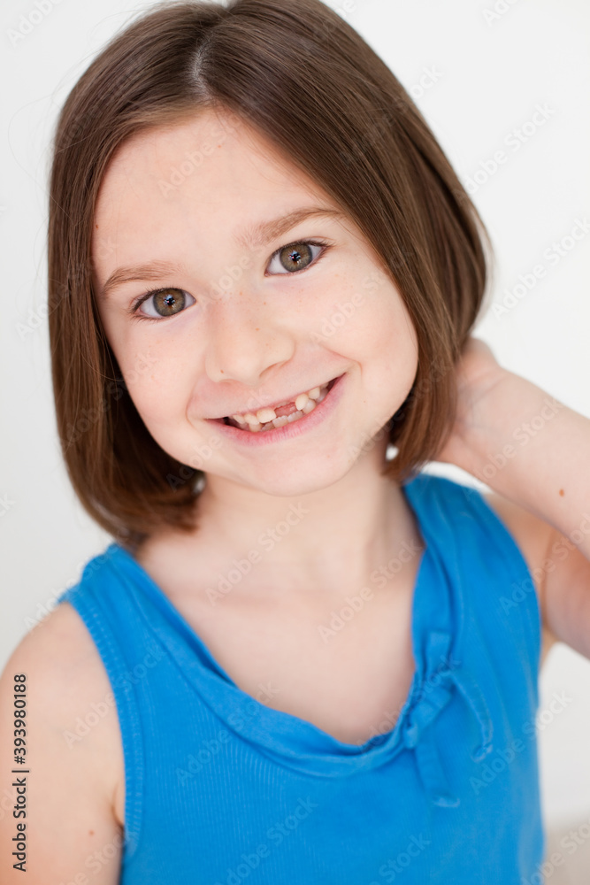 Smiling Little Girl with Brown Hair and Missing Teeth, Happy Childhood Portrait Smiling Little Girl with Brown Hair and Missing Teeth, Happy Childhood Portrait