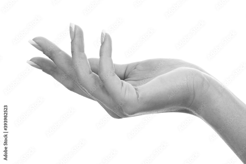 Closeup shot of woman's hand with french manicure and clean and soft skin over a white background, isolated