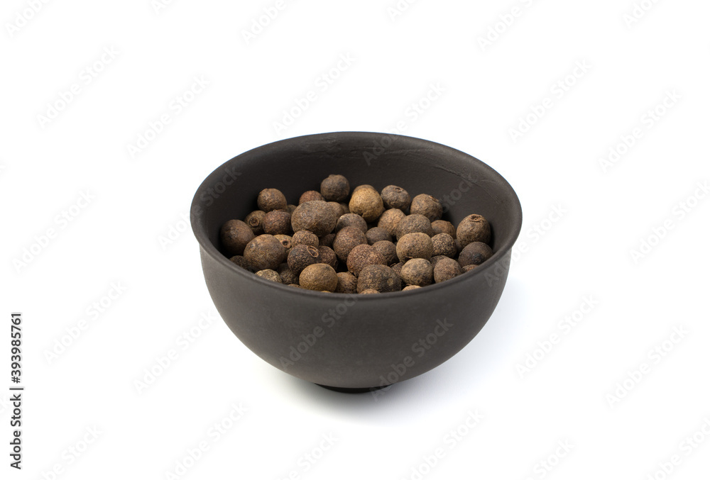 Peas of fragrant pepper Cup on a white background. Side view with space for copying. Peas of fragrant pepper Cup on a white background. Side view with space for copying.