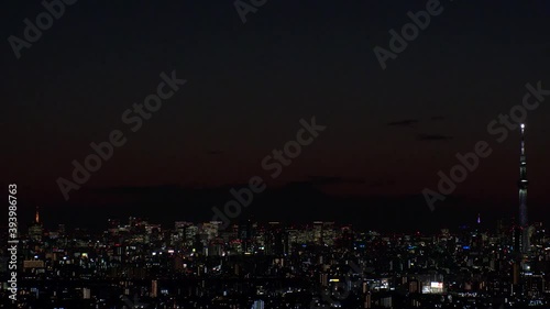 Wallpaper Mural TOKYO, JAPAN : Aerial sunrise CITYSCAPE of TOKYO and MOUNT FUJI. View of rising sun and buildings at downtown. Japanese city life and nature concept. Time lapse tracking shot night to morning. Torontodigital.ca