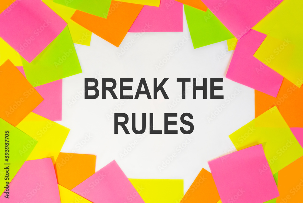 Text break the rules clue on a white background. Multicolored stickers around