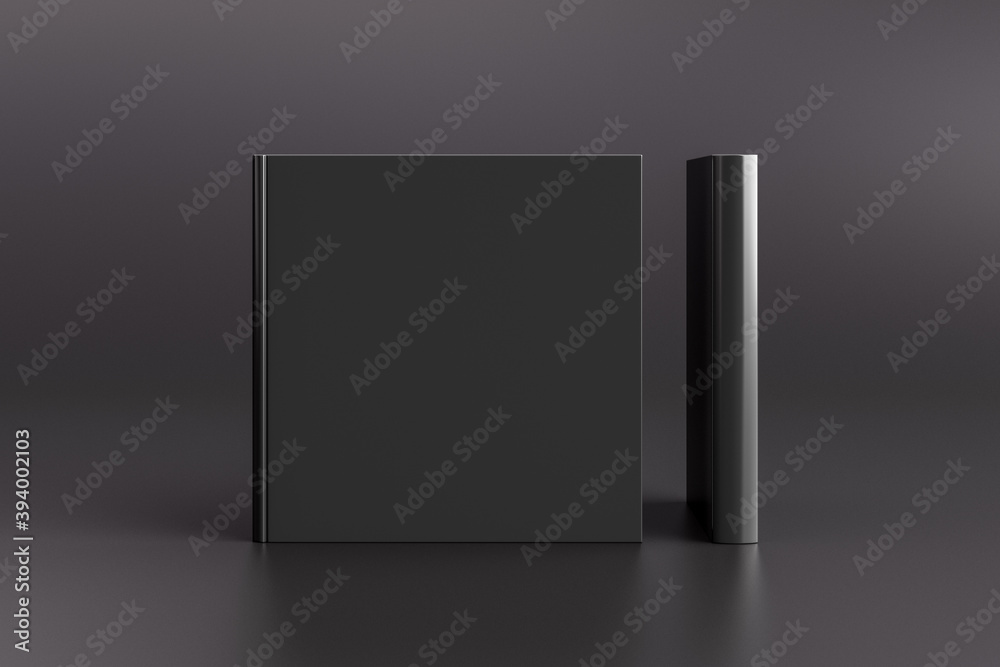 Two hardcover square black mockup books standing on the black background. Blank front cover and spine of book. Two hardcover square black mockup books standing on the black background. Blank front cover and spine of book.