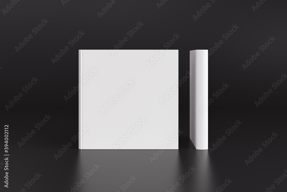 Two hardcover square white mockup books standing on the black background. Blank front cover and spine of book. Two hardcover square white mockup books standing on the black background. Blank front cover and spine of book.