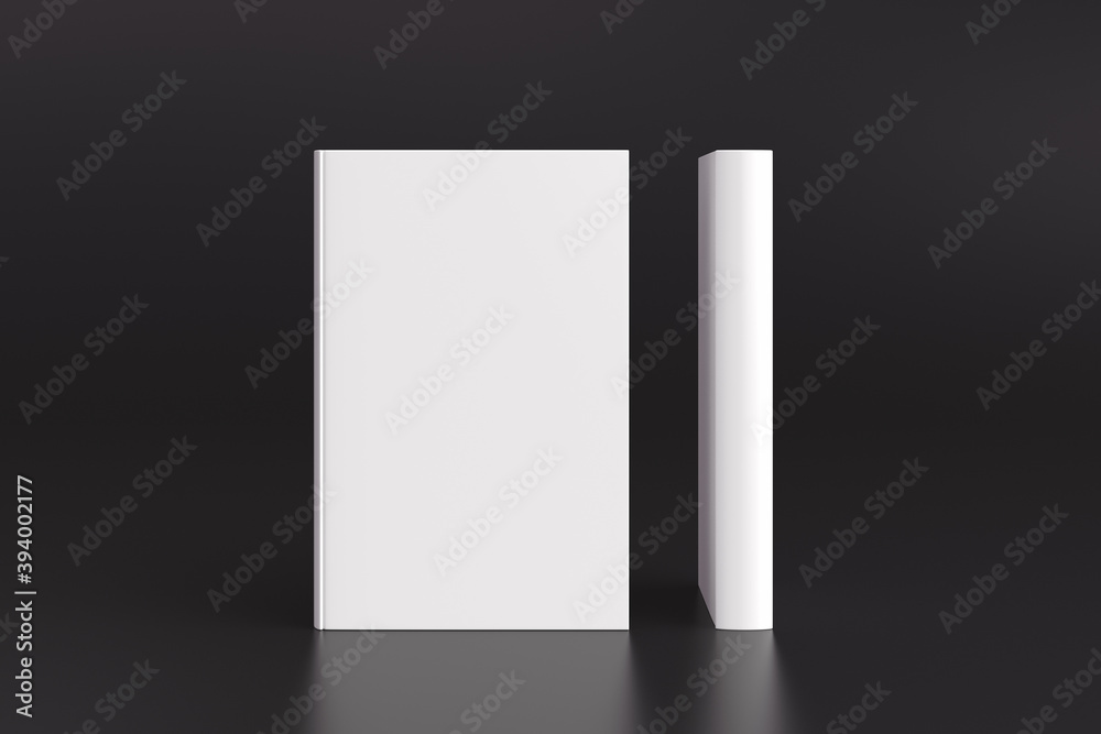 Two hardcover vertical white mockup books standing on the black background. Blank front cover and spine of book. Two hardcover vertical white mockup books standing on the black background. Blank front cover and spine of book.