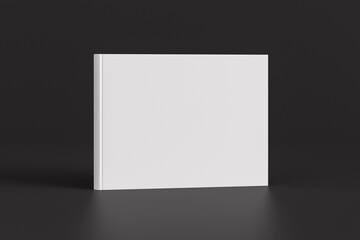 Fototapete Grau 2 Hardcover horizontal or landscape white mockup book standing on the black background.  © dimamoroz