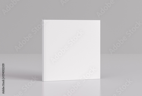 Hardcover square white mockup book standing on the white background.