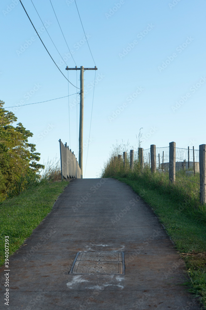 rural footpath with power lines above