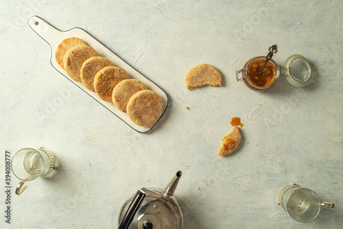 Moroccan Harcha Semolina pan fried. Flatbread served with honey or syrup made from melted butter and honey. Harcha is a traditional breakfast from the north of Africa photo