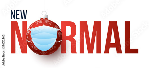New normal Christmas concept banner card. Merry Christmas and happy new year new normal concept. Face mask on xmas tree ball bauble. Corona virus protection