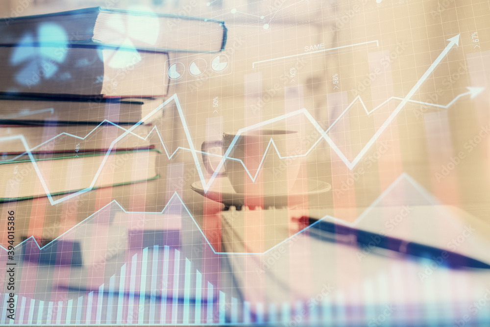 Double exposure of financial chart drawing and desktop with coffee and items on table background. Concept of forex market trading Double exposure of financial chart drawing and desktop with coffee and items on table background. Concept of forex market trading