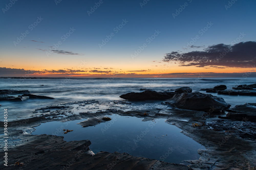 Rocky coastline sunrise seascape